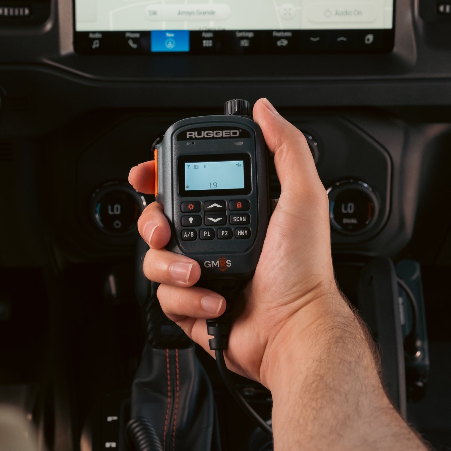 G2 Mini display hand mic being used in a vehicle