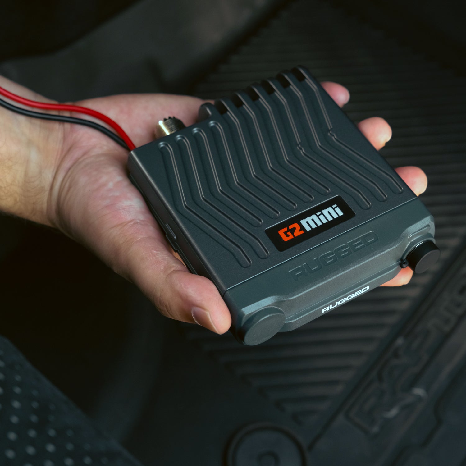 Compact G2 Mini radio chassis held in one hand